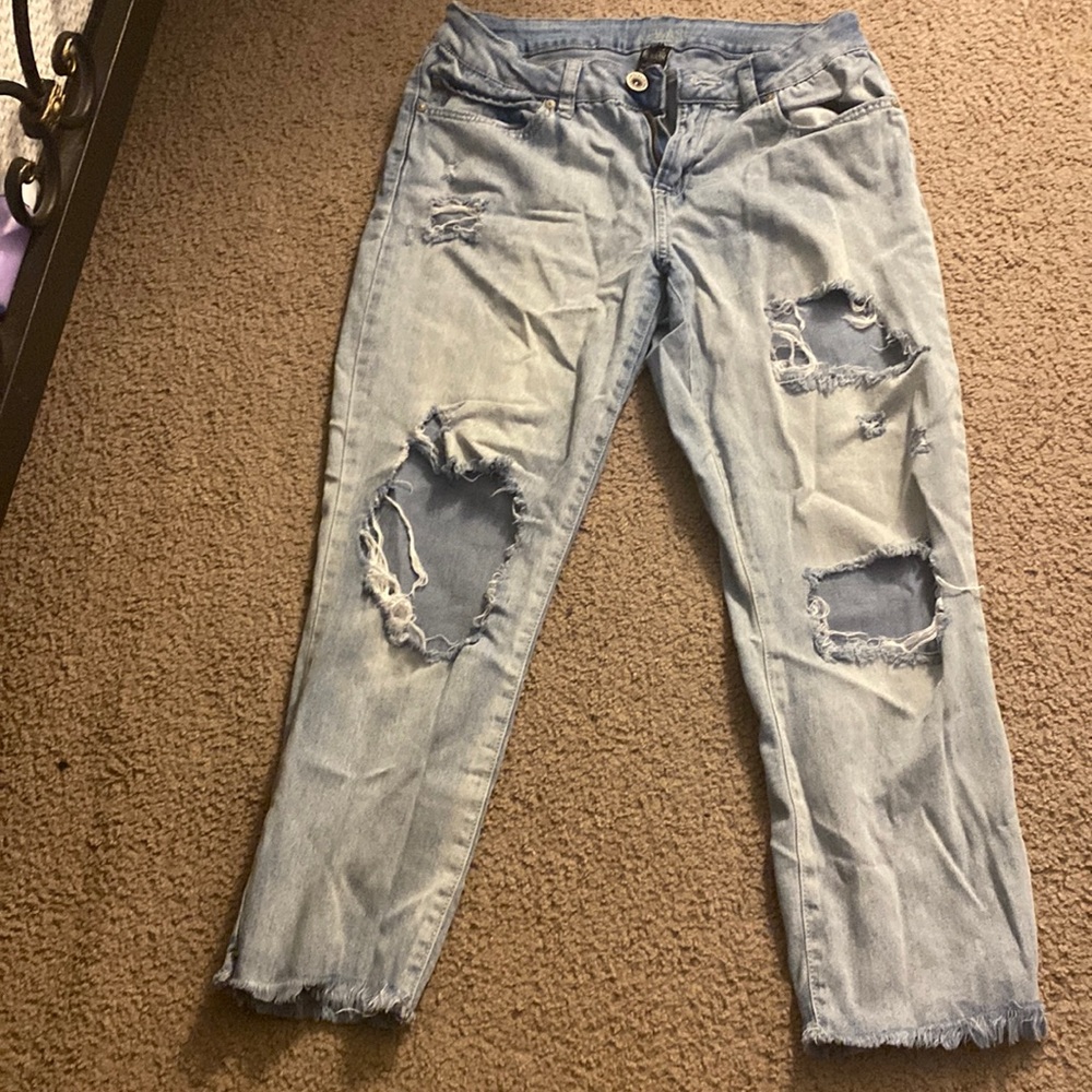 Blue ripped jeans fringe bottom